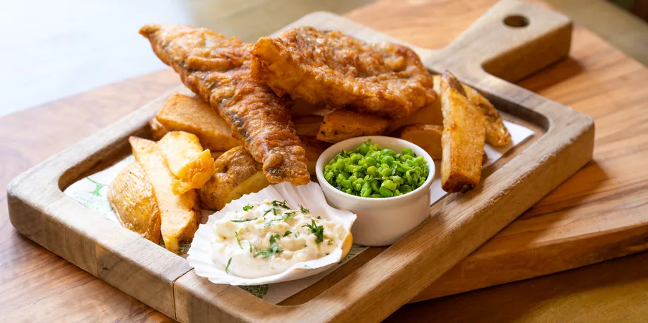 Beer-battered fish and chips with mushy peas and tartare sauce