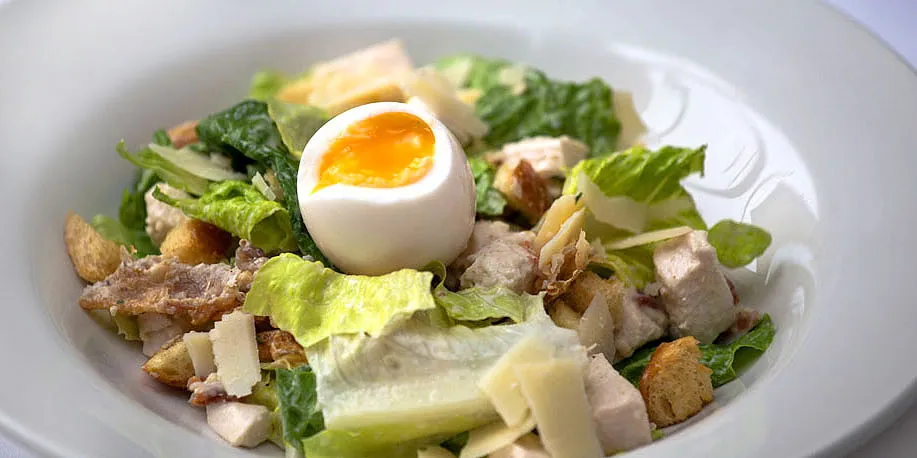 Caesar salad with soft-boiled egg