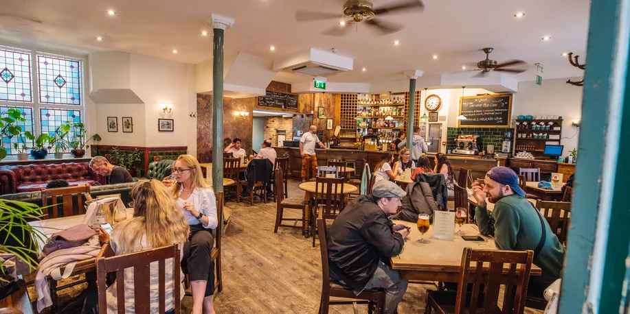 Guests enjoying a busy afternoon at The Warwick